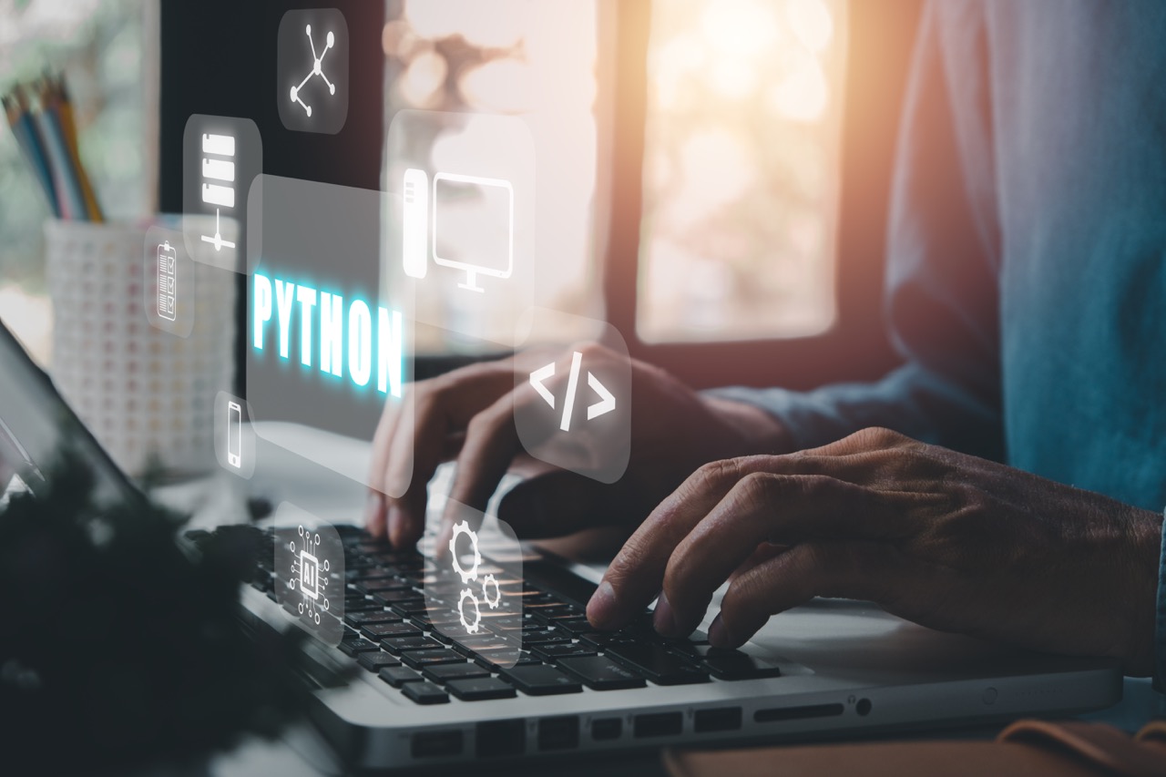 Python Programming Language,Man using laptop computer with python programming icon on virtual screen, Application and web development concept.